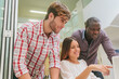 © ADDICTIVE STOCK - Young Entrepreneurs Working at the Office and Checking a Project on Screen