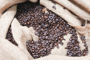 Poster - Studio Shot of Coffee Beans in a Bag as background