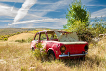 Old Abandoned Red Car In The Countryside