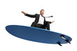 © Ljupco Smokovski - Businessman surfing on a surfboard