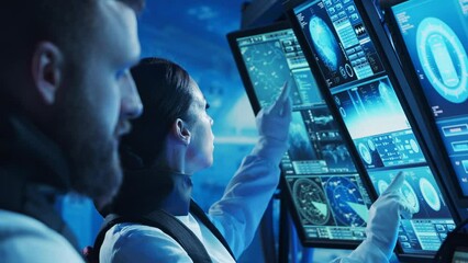 Wall Mural - Team of astronauts in a space suits aboard the orbital station. A crew of cosmonauts piloting the spaceship. Man and woman in space. Galactic travel and science concept.