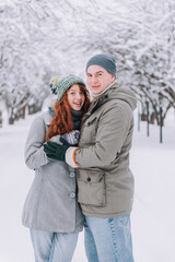 Wall Mural - happy couple in love posing in cold winter weather.