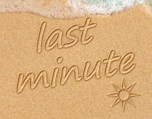 closeup of a last minute  written in it, on the sand of a beachdecoration of sand