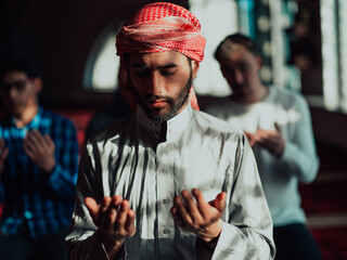 Muslim Arabic man praying. Religious muslim man praying inside the mosque during ramadan