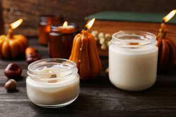 Wall Mural - Many different burning candles on wooden table