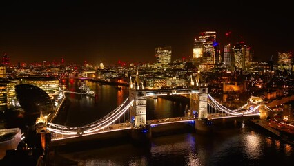 Wall Mural - Aerial view over the illuminated Tower Bridge in London at night - travel photography