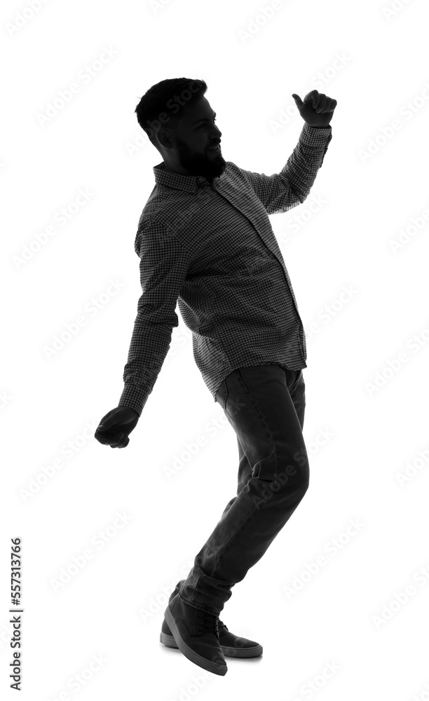 Silhouette of young man dancing on white background