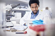© Jesse B/peopleimages.com - Science, research and black man with tablet, focus and innovation for healthcare and laboratory. Scientist, researcher or medical professional for diagnosis, concentration and online for cure or tech
