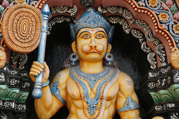 Sticker - Hanuman with a fan close-up. Divine hero of the Ramayana on the wall of a Hindu temple in Puri.