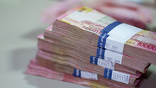 A Pile Of 100 Thousand Rupiah Denominations, A Pile Of Rupiah Bills, Indonesian Rupiahs, Banknotes