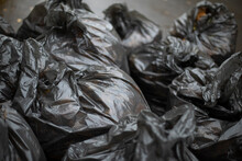 Black Garbage Bags. Cleaning On Street. Waste Bags. Black Plastic.