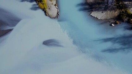 Wall Mural - Blue glacial waters at the confluence of Knik River and Eklutna Tailrace in Alaska