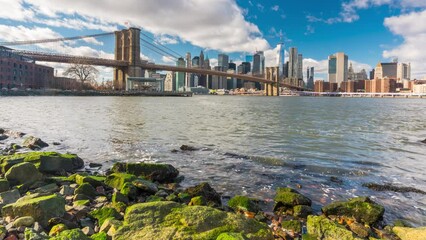 Fototapete - Timelapse of Brooklyn bridge and Manhattan at cloudy day, New York City.