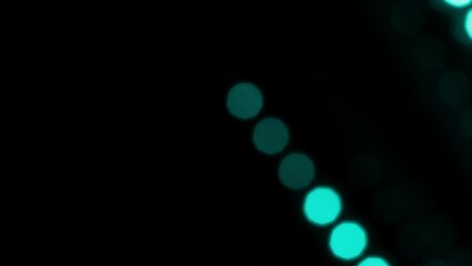 Wall Mural - Diagonal Motion Of Turquoise Round Bokeh Lines. Abstract moving background with natural lens flare effect of blurry particles. Can be used as background, screen or overlay. Loop 4K video
