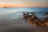 Fototapeta Do pokoju - Sunset and rock on the sea in Crete Greece, Hersonissos