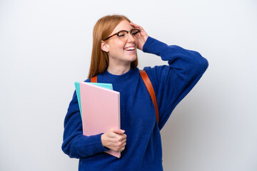 Wall Mural - Young student redhead woman isolated on white background smiling a lot