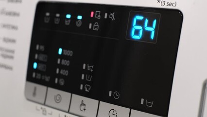 Close-up of the washing machine display. Detail of the washing machine display during washing. 
