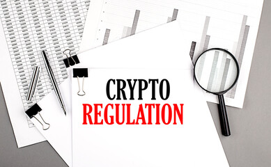 Poster - CRYPTO REGULATION text on paper on chart background