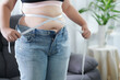 Leinwandbild Motiv Obese Woman with fat belly in dieting concept. Overweight woman touching his fat belly and want to lose weight. Fat woman her waist with a centimeter..Shape up healthy stomach muscle 