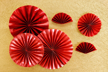 Wall Mural - Chinese new year festival decoration with red Chinese folded fans on golden background. Celebrate Happy Chinese new year background concept. Top view.