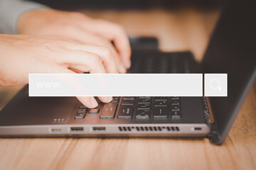 Poster - Businessman's hand working with computer laptop on desk in home. Searching Browsing Internet Data Information with blank search bar. Search Engine Optimization SEO Networking Concept.