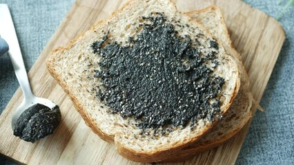 Canvas Print - Black sesame spread on a bread 