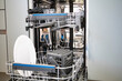 © Igor Bastrakov - Built-in dishwasher in the kitchen, washing dishes. Plates, cups, glasses are worth washing. Household chores, everyday life