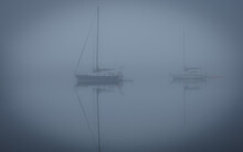 In The Fog, Sailboats Anchored