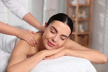 Poster - Beautiful woman receiving back massage in beauty salon, closeup