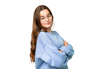 teenager girl over isolated chroma key background with arms crossed and looking forward