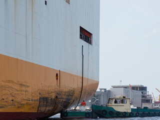 dock worker discharged sludge oil from a berthing vessel in lagos