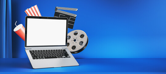Poster - Online movie watching and cinematography concept with blank white modern laptop screen with blank place on empty blue cinema background with popcorn and film-strip. 3D rendering, mock up