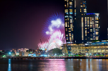 Wall Mural - Sydney Harbour Bridge New Years Eve fireworks, colourful NYE fire works lighting the night skies with vivid multi colours NSW Australia. Happy New Year. New Year Eve