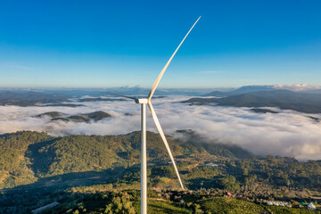 PANORAMIC VIEW OF WIND FARM OR WIND PARK, WITH HIGH WIND TURBINES FOR GENERATION ELECTRICITY WITH COPY SPACE. GREEN ENERGY CONCEPT, CAU DAT, DA LAT, VIETNAM