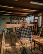 © ADDICTIVE STOCK - Craftsman working with wood in workshop