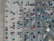 © TxemaPhoto - Parking. Aerial view of cars parked in line in a parking lot. Colored cars. drone view
