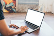 © panitan - computer screen blank mockup.hand woman work using laptop with white background for advertising,contact business search information on desk at coffee shop.marketing and creative design