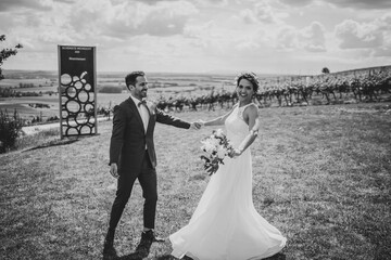 Wall Mural - Wedding couple in the vineyards of Rheinhessen in black and white	