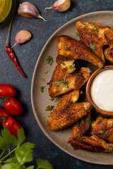 Wall Mural - Baked chicken wings. Served with sauce or fries.