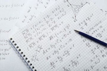 Wall Mural - Notebook with different mathematical formulas and pen, top view