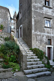 Fototapeta Panele - A narrow street among the old houses of Montesarchio, a village in the province of Benevento in Italy.