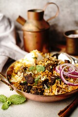 Wall Mural - Homemade Goat Fry biryani | Mutton dum biryani served with yogurt raita, selective focus