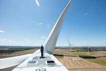 Man On Top Of A Wind Turbine