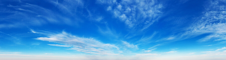 Blue Sky background with tiny Clouds. Panorama background