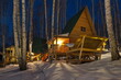 Russia. Krasnoyarsk Territory. Night view of guest houses in a birch grove on the shore of the lake Steam room rich in fish. This is an overnight stay for numerous fishermen.