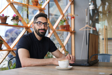 Portrait of Arab Arabian young handsome happy muslim bearded man with beard in casual clothes, islamic person 