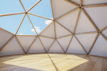 Interior Of Large Geodesic Wooden Dome Tent With Window And View To Sky. Empty Interior Glamping Tent.