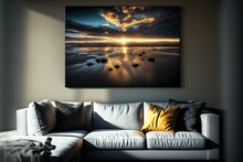  A Living Room With A White Couch And A Painting On The Wall Above The Couch Is A Picture Of The Sun Setting Over The Water And Rocks In The Water On The Beach Below It.
