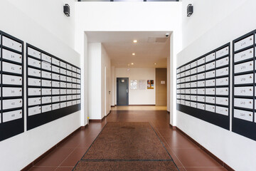 mailboxes in the lobby of an apartment building