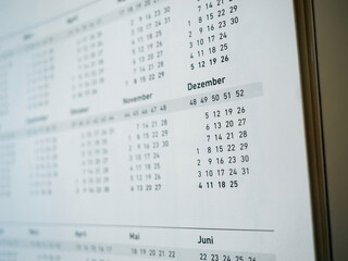 Close-up macro shot of defocused December month on a German calendar page - Dezember